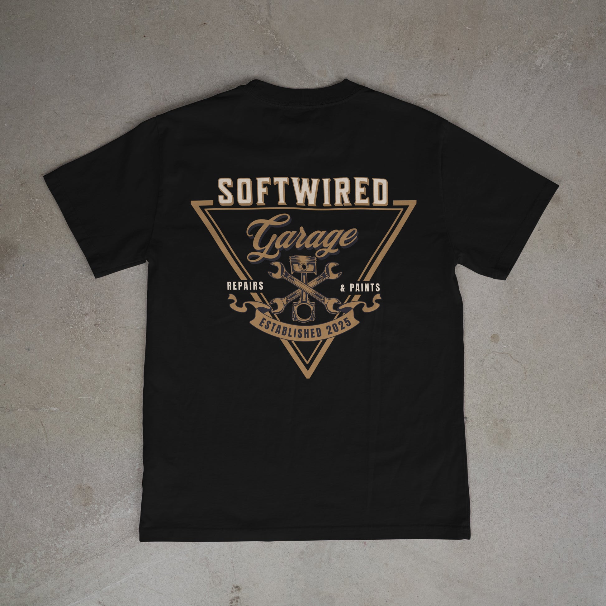 Black t-shirt with 'Softwired Garage' logo on a gray surface