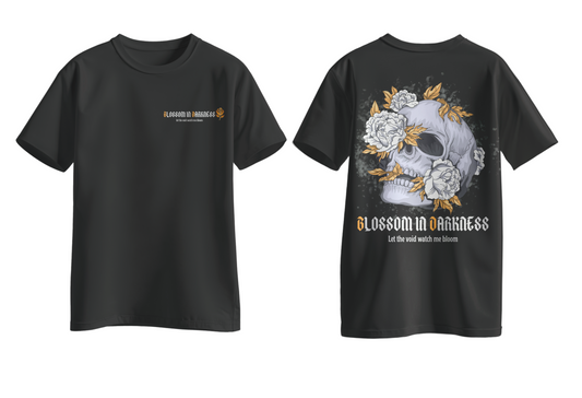 Black t-shirt with skull and floral design on the back, on a light gray background