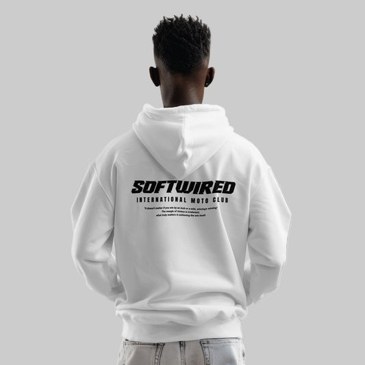 Person wearing a white hoodie with 'SOFTWIRED' text on the back against a gray background