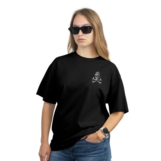 Person wearing a black t-shirt with a skull and crossbones design on a plain background
