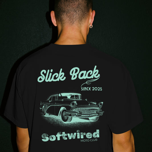 Person wearing a black t-shirt with a graphic design and text on the back.